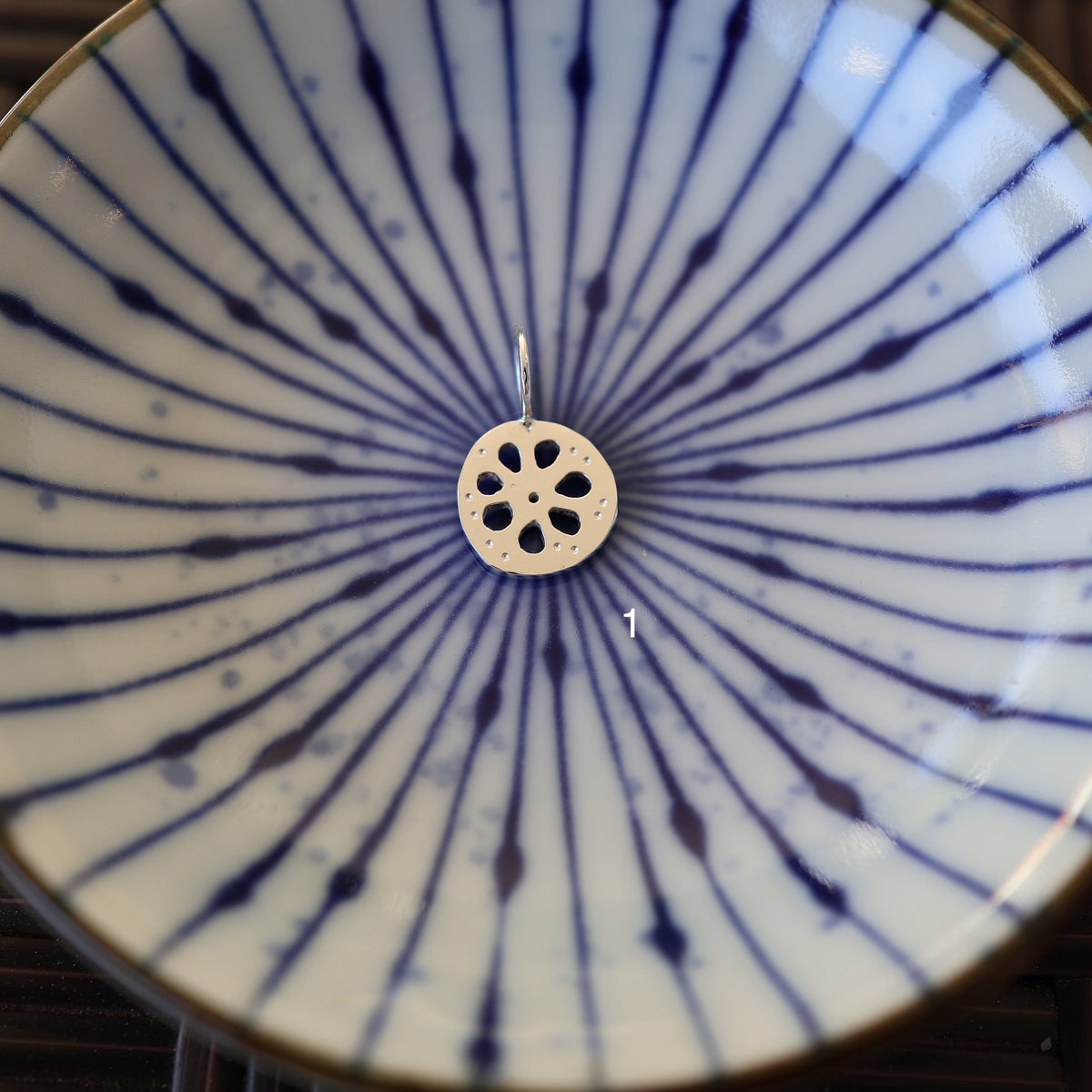 a lotus root pendant labeled '1'