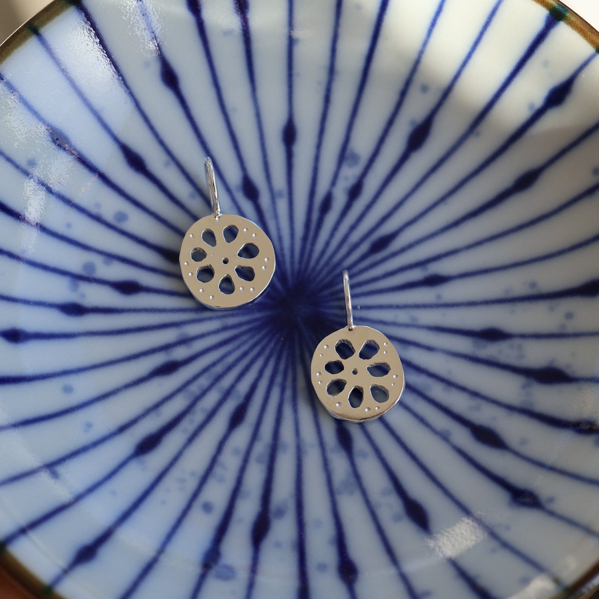 two silver lotus root charms