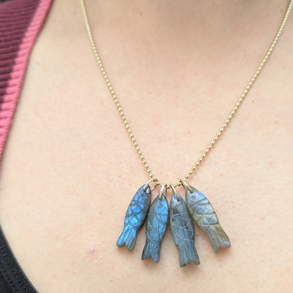 Necklace with 4 fish shaped pendants