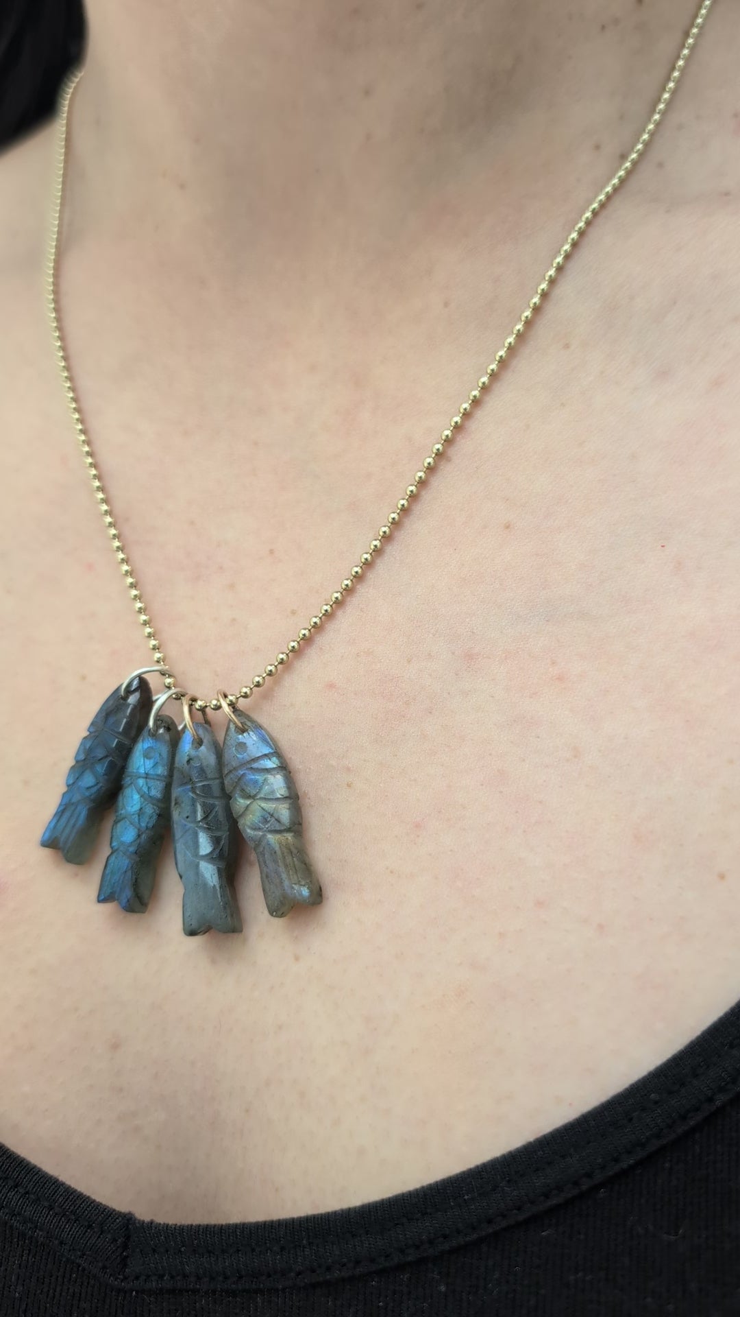 Necklace with 4 fish shaped pendants